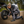 Motorcycle rider using the MotoPressor SmartPUMP cordless tyre inflator to check tyre pressure on the road