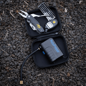 Compact motorcycle tyre repair kit with digital gauge and air pump